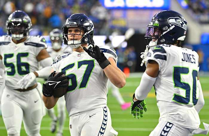 Seattle Seahawks linebacker Cody Barton (57) is celebrates with linebacker Vi Jones (50) after defeating the Los Angeles Rams at SoFi Stadium.